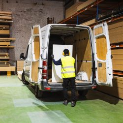 Worker Loading Plywood Into Delivery Van In Lumber 2026 02 07 22 49 47 Utc